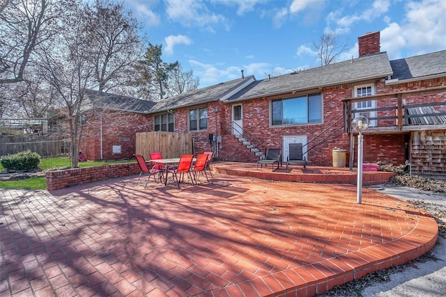 wooden terrace featuring a patio