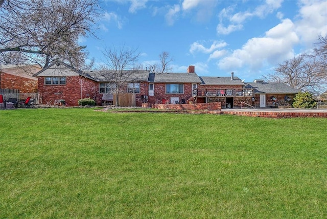 rear view of property featuring a yard