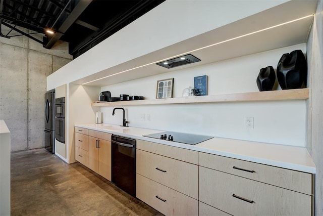 kitchen with light brown cabinetry, sink, and black appliances