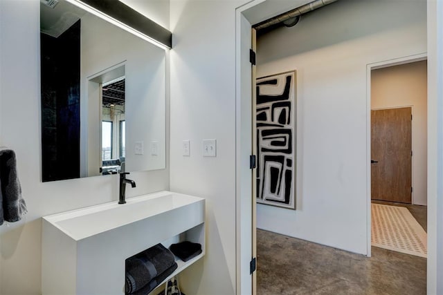 bathroom featuring concrete floors