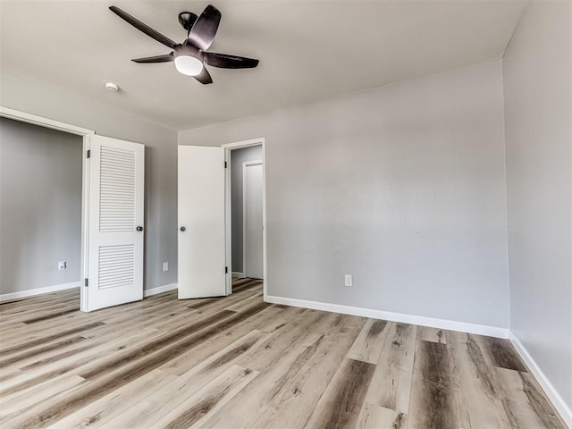 unfurnished bedroom with a closet, ceiling fan, and light hardwood / wood-style flooring