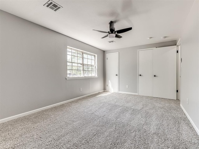 unfurnished bedroom featuring carpet flooring and ceiling fan