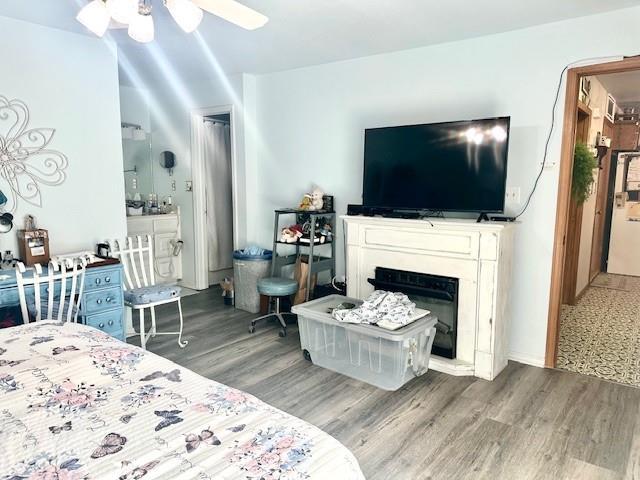 bedroom featuring ceiling fan and hardwood / wood-style floors