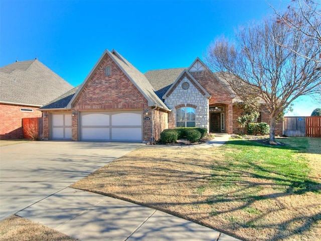 view of front of home featuring a garage and a front yard