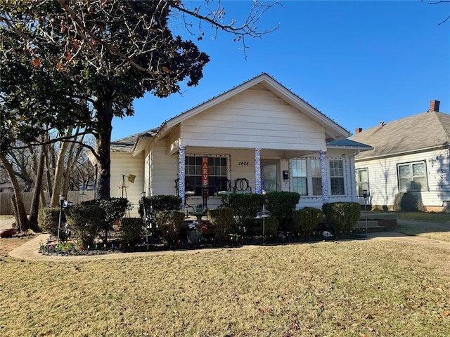 view of front facade with a porch and a front lawn