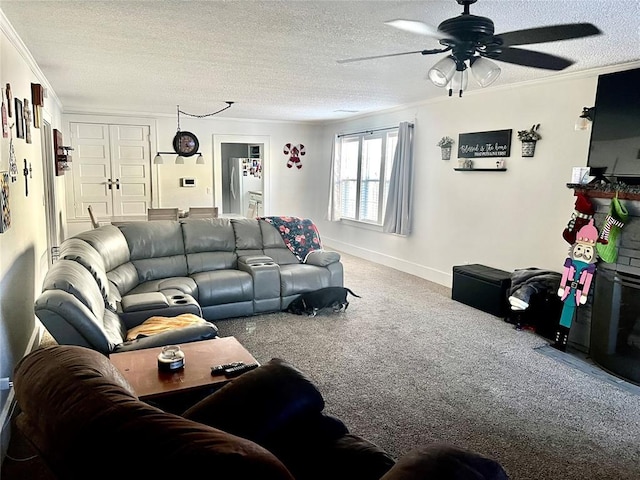 carpeted living room with a textured ceiling, ceiling fan, and ornamental molding