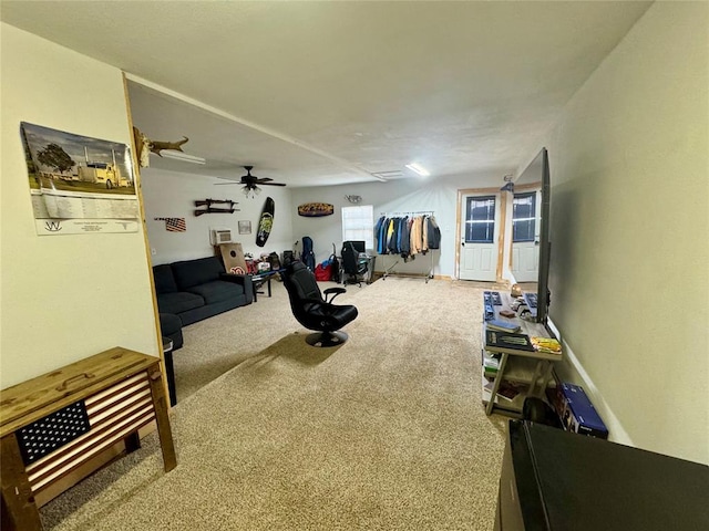 exercise room featuring carpet floors and ceiling fan