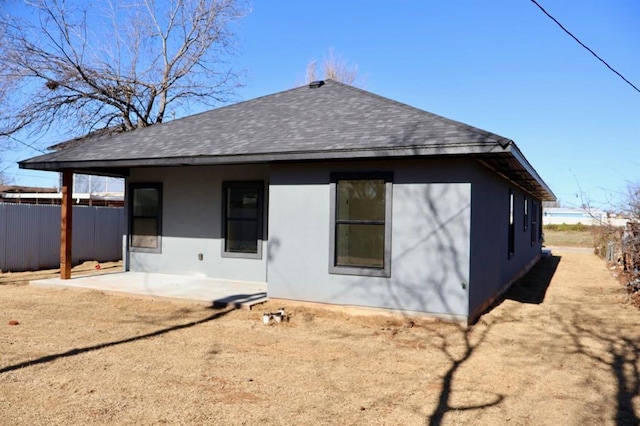 rear view of property featuring a patio area