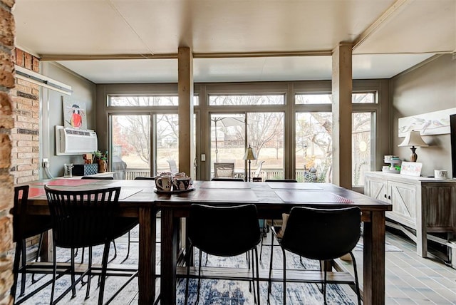 dining room with cooling unit and a barn door