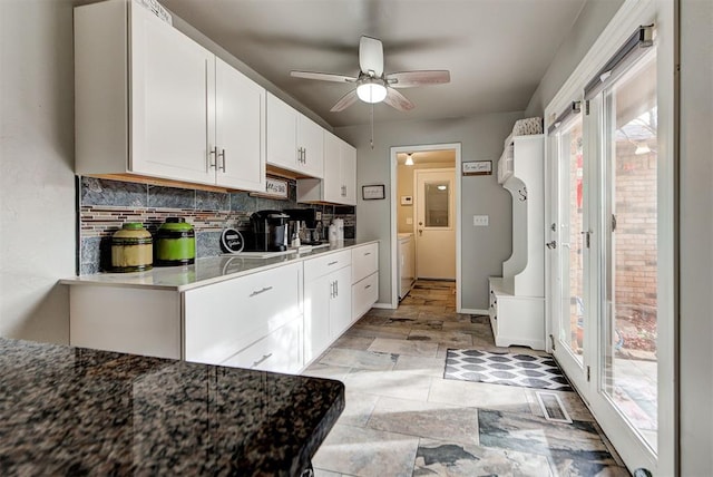 kitchen with white cabinetry, tasteful backsplash, and ceiling fan