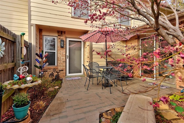 view of patio / terrace with outdoor dining space and fence