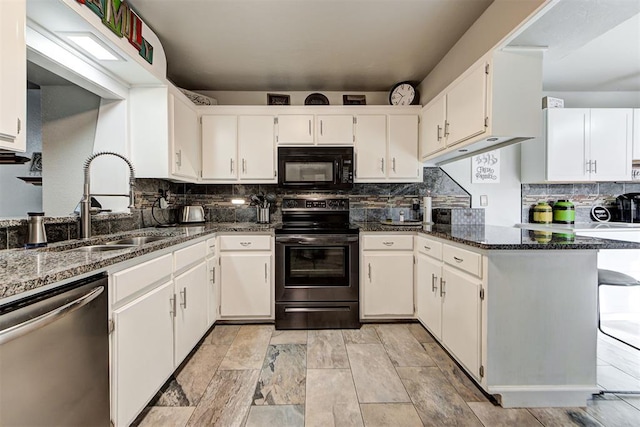 kitchen with electric range oven, stainless steel dishwasher, white cabinetry, a sink, and black microwave