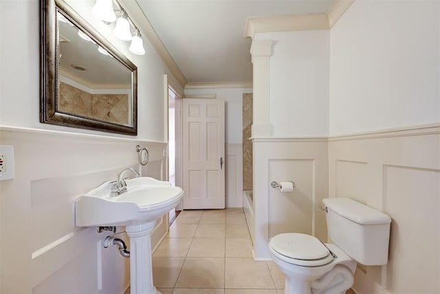 full bath with tile patterned floors, toilet, and crown molding