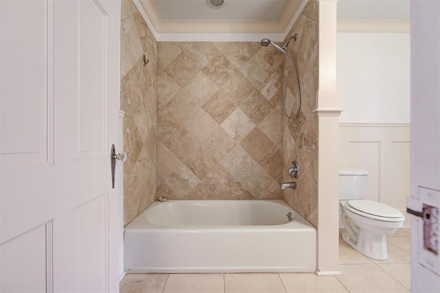 bathroom featuring toilet, washtub / shower combination, and tile patterned flooring