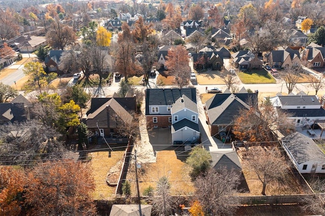 birds eye view of property with a residential view