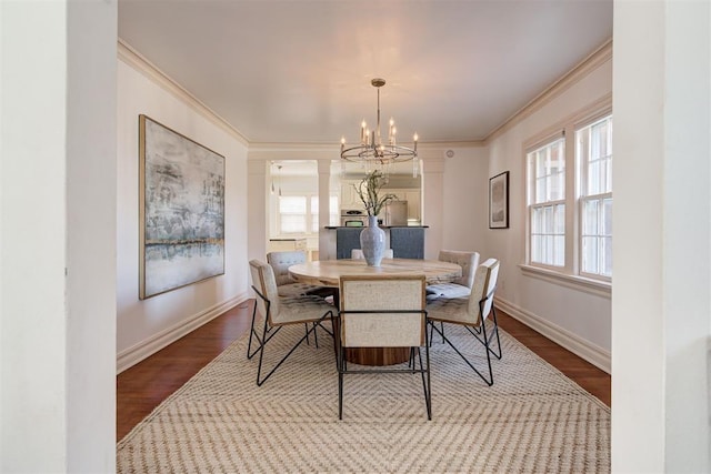 dining room with baseboards, dark wood-style flooring, and crown molding