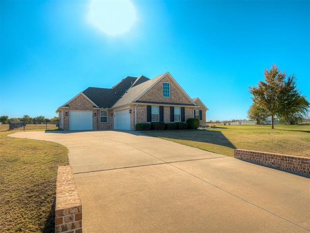 view of front of home with a garage and a front lawn