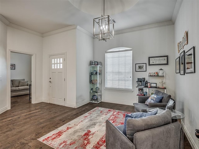 living room with a notable chandelier, plenty of natural light, crown molding, and dark wood-type flooring