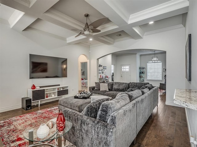 living room featuring crown molding, dark hardwood / wood-style flooring, beamed ceiling, and ceiling fan with notable chandelier