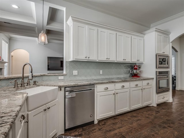 kitchen with white cabinetry, sink, hanging light fixtures, dark hardwood / wood-style floors, and appliances with stainless steel finishes