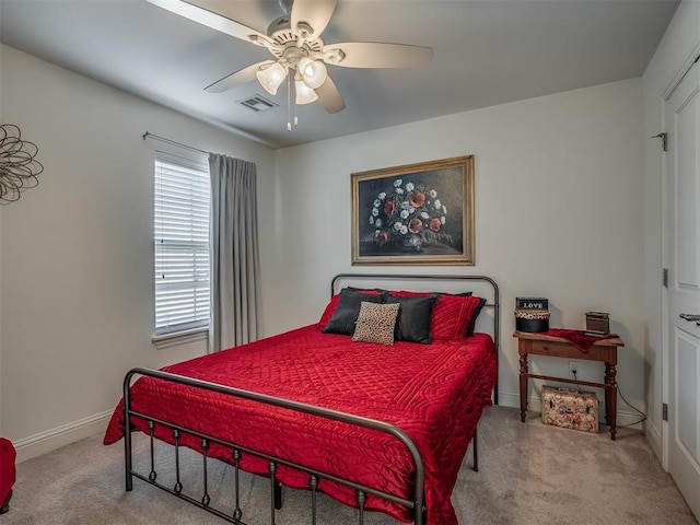 bedroom with light carpet and ceiling fan