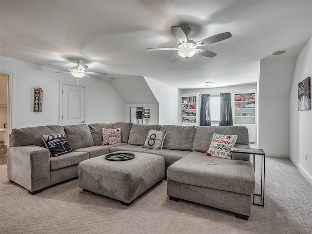 carpeted living room with ceiling fan