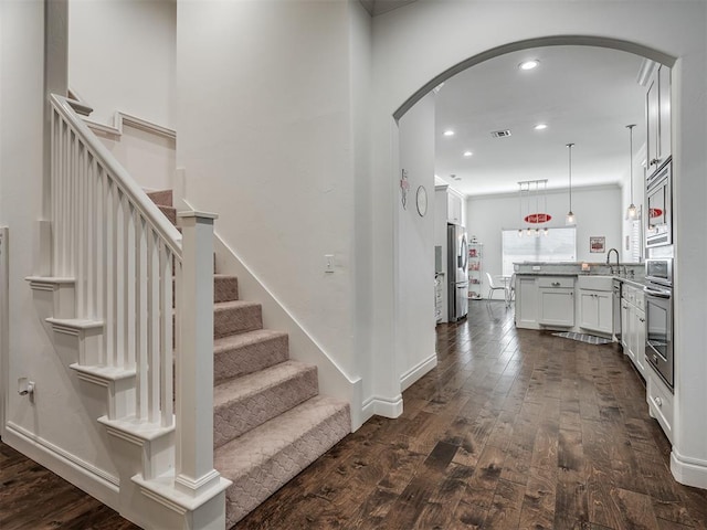 foyer with sink and dark hardwood / wood-style floors