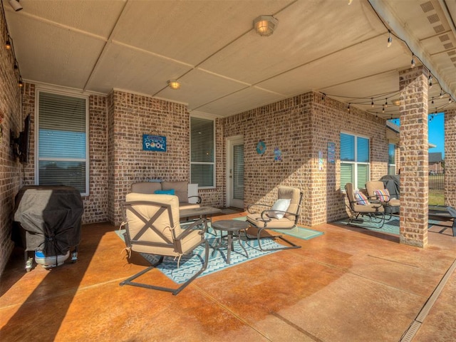 view of patio / terrace with an outdoor hangout area and a grill