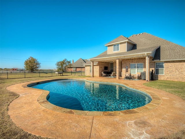 view of pool with a yard and a patio