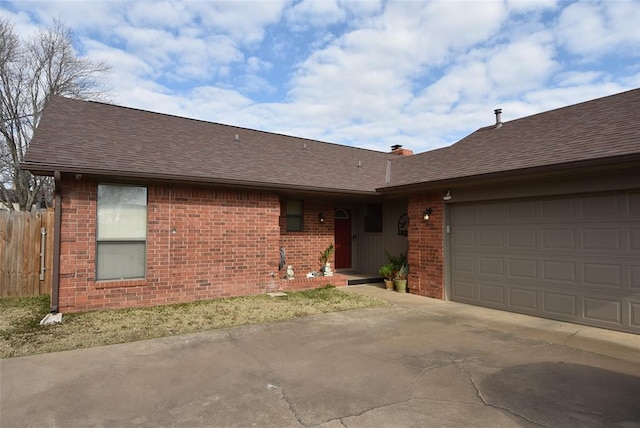 ranch-style home featuring a garage