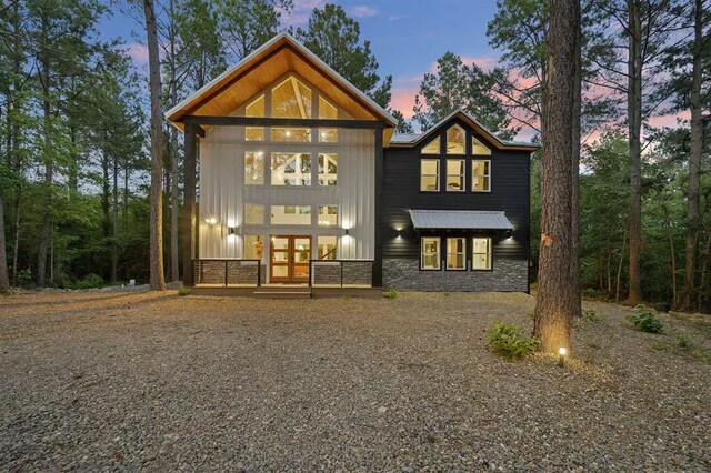 back house at dusk with french doors