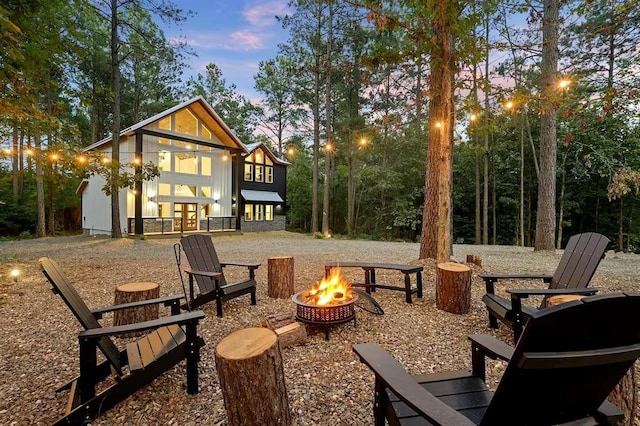 patio terrace at dusk with a fire pit