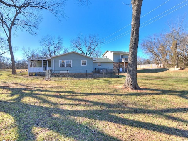 exterior space with covered porch and a yard