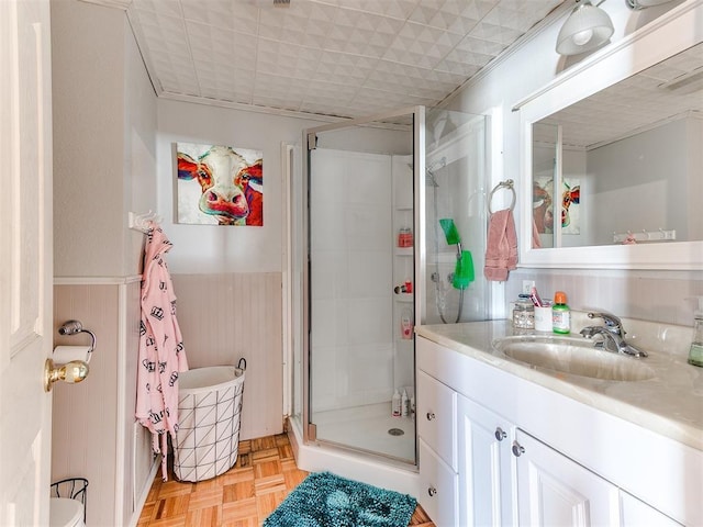 bathroom with wood walls, separate shower and tub, vanity, and parquet flooring