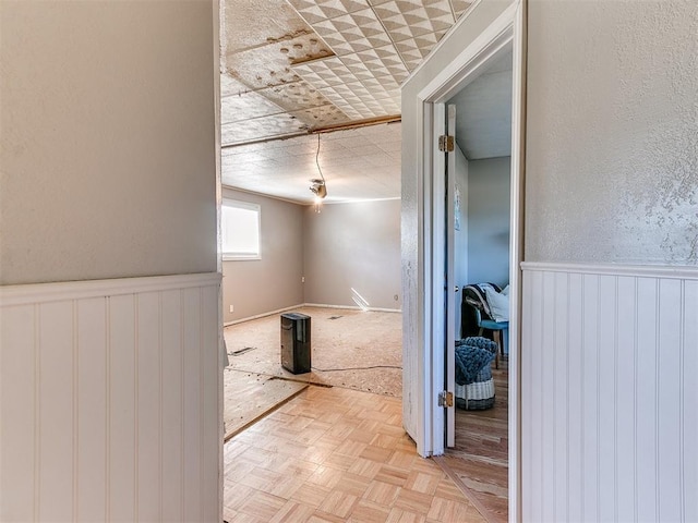 corridor with light parquet floors