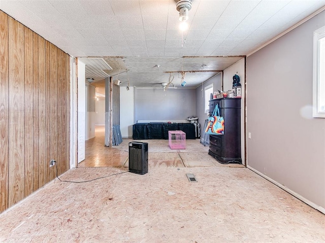 interior space featuring wood walls