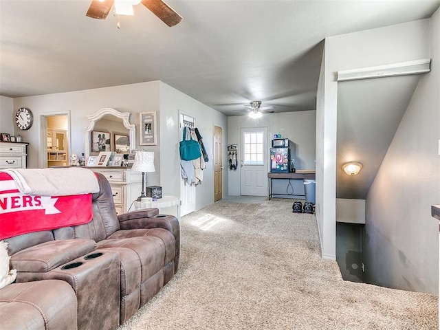 carpeted living room with ceiling fan