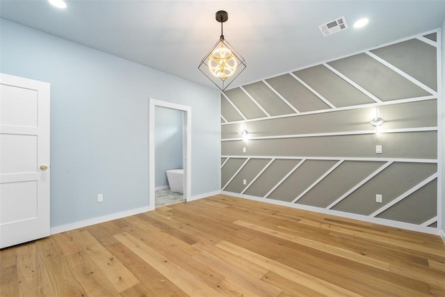 unfurnished room featuring hardwood / wood-style floors