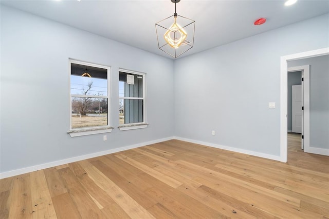 empty room with hardwood / wood-style flooring