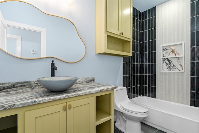 full bathroom featuring tile patterned flooring, vanity, toilet, and tiled shower / bath combo