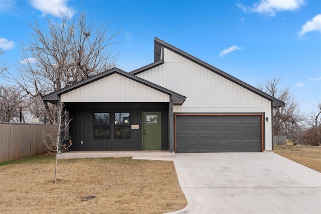 modern inspired farmhouse featuring a garage