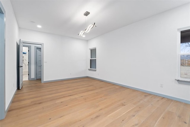 spare room with light wood-type flooring