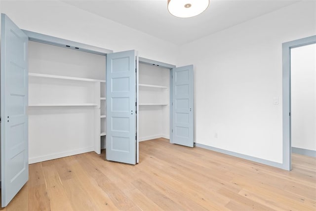 unfurnished bedroom featuring light wood-type flooring