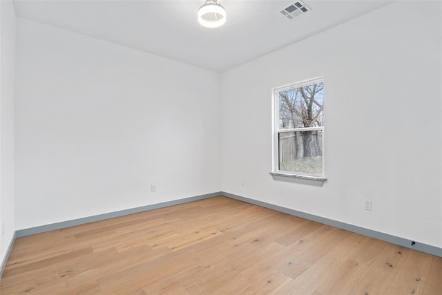 unfurnished room featuring light wood-type flooring