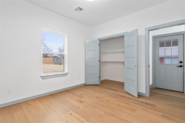 unfurnished bedroom featuring light wood-type flooring