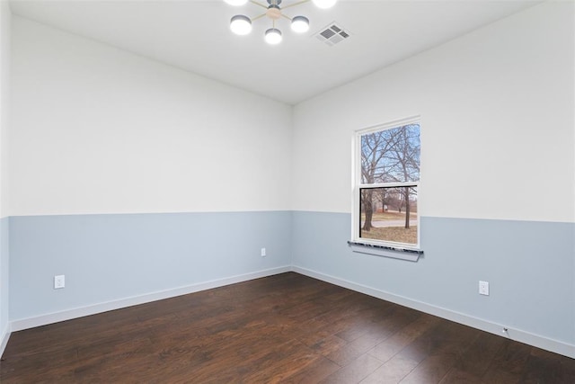 unfurnished room featuring dark wood-type flooring