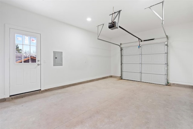 garage featuring electric panel and a garage door opener