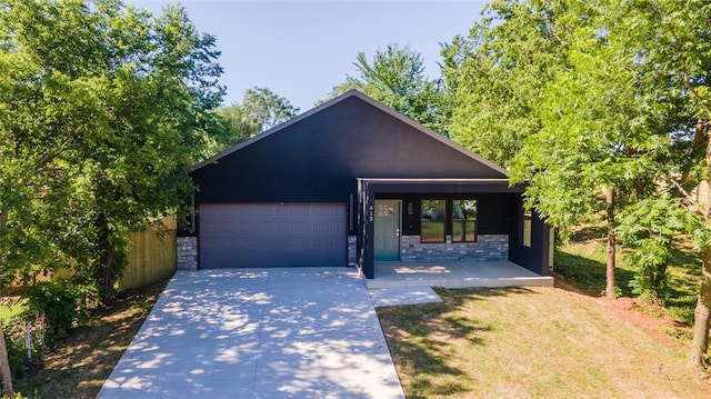 view of front of home featuring a porch and a garage