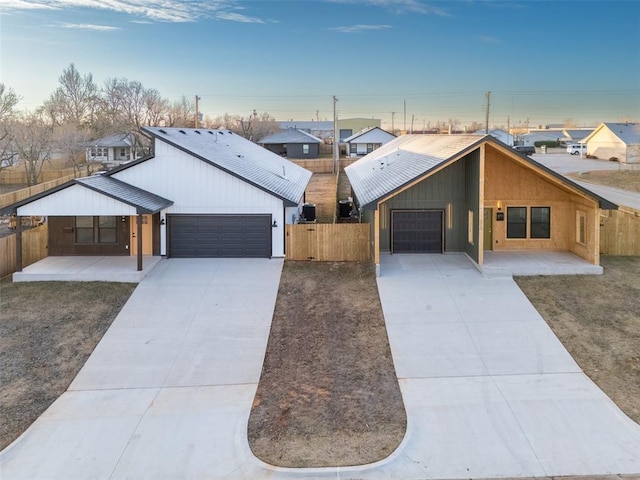 view of front of property featuring covered porch and a garage