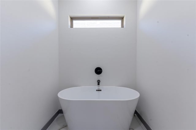 bathroom featuring a tub to relax in